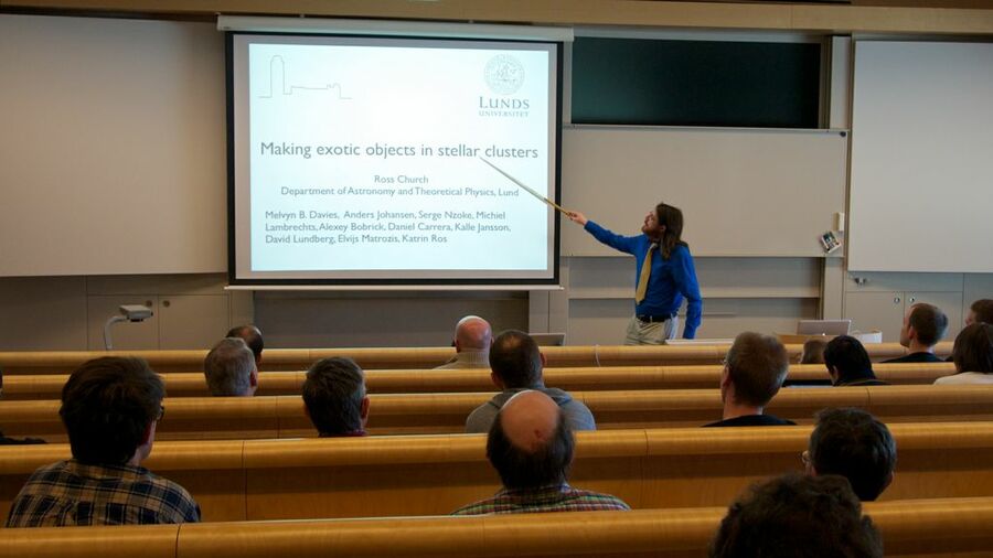 Ross Church pointing to the title of his talk.