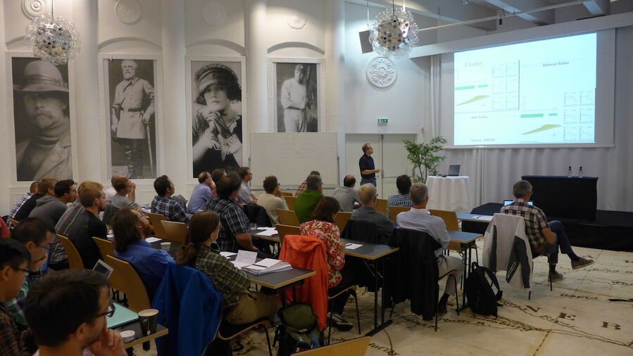 Johan Revstedt giving a talk with the audience in front listening